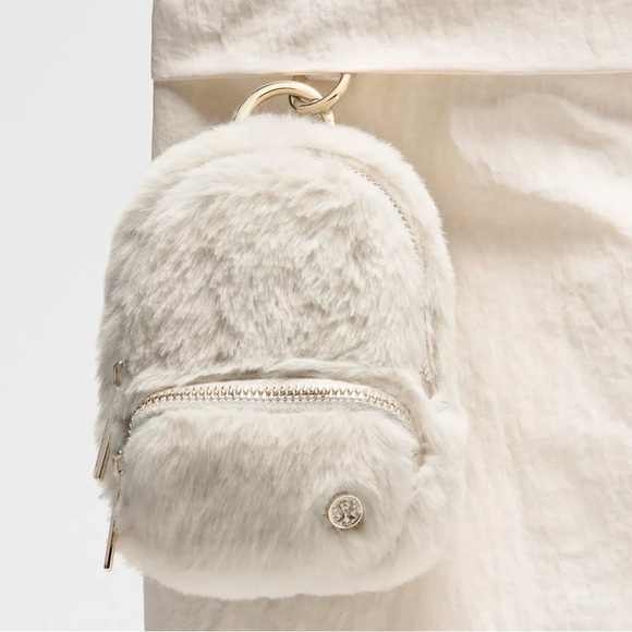 Lululemon Athletica Cream Faux Fur Everywhere Nano backpack clip - Picture 2 of 4